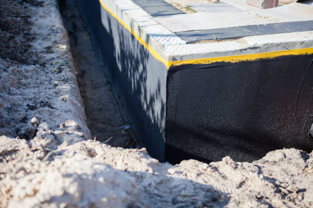 Professional Exterior Waterproofing technician working in Webberville, MI